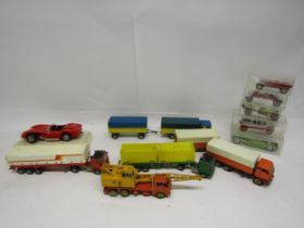 A collection of playworn diecast model vehicles including Dinky Supertoys 20 Ton Crane, Siku,