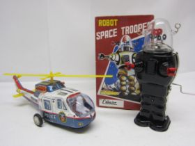 A boxed Ha Ha Toys (China) tinplate clockwork Robot Space Trooper and and and unboxed tinplate
