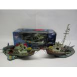 A boxed McFarlane Toys Jaws Deluxe Boxed Set model depicting great white shark attacking boat (box