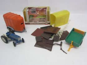 A Britains 9524 Ford 6600 empty window box, a heavily playworn Ford 5000 tractor, Beaufort Double