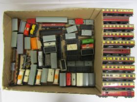 A collection of loose playworn Hornby Dublo 00 gauge rolling stock to include various goods wagons