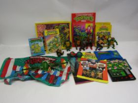 A collection of vintage Teenage Mutant Ninja Turtles toys including action figures, Tomy