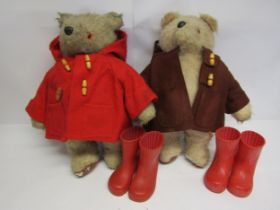Two vintage Gabrielle Designs Paddington Bears, one in red duffle coat, the other brown, with