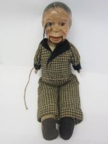 A 1930s Reliable Toys (Canada) ventriloquist doll, painted composition head with monocle and pull-