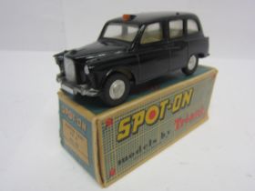 A Triang Spot-On 155 diecast model Austin Taxi in black, cream interior with red plastic steering