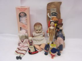 A collection of dolls and character toys to include painted wooden peg doll, Sunny Jim rag doll in