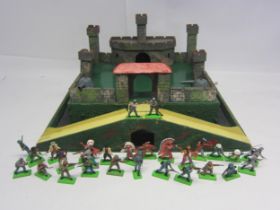 A painted wooden model fort with metal gun turrets, together with a collection of twenty-eight
