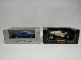 Two boxed 1:18 scale diecast model cars to include Revell promotional Audi TT Coupe and Burago