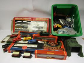 A collection of playworn 00 gauge model railway rolling stock and accessories including Hornby