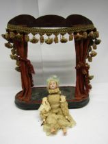An early 20th Century Strobel & Wilken bisque head acrobat automaton with turning arms and nodding