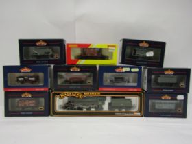 A boxed Mainline 00 gauge 37-053 Standard Class 4 locomotive and assorted boxed rolling stock to