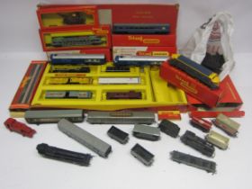 A collection of predominantly Triang 00 gauge model railway locomotives, rolling stock and