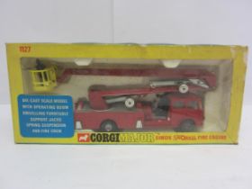 A boxed Corgi Toys Major diecast 1127 Simon Snorkel Fire Engine, complete with fire crew figures and