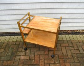 A 1970's gold coloured metal and faux marble drinks trolley