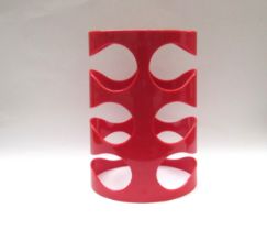 An Umbra Ran Lerner design red plastic wine bottle holder for eight bottles, 38.5cm tall