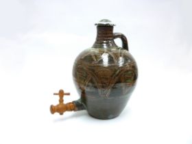 An Abuja Pottery stoneware flagon with screw top in the Michael Cardew tradition, strap handle. Iron