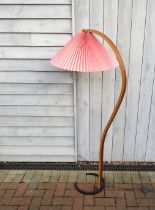 A Danish floor lamp by Mads Caprani, c1970's, stamped to iron base, laminated wood stem, red pleated