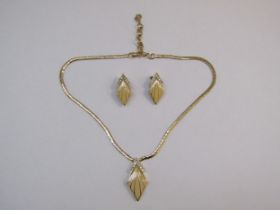 A 1980's Dior jewellery set comprising necklace and clip on earrings, all fully marked