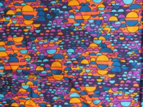 A length of dress fabric with bright multicoloured printed semi circles, approximately 400cm long