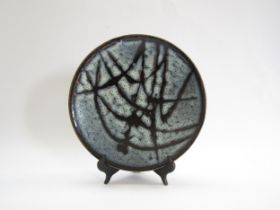 A Mashiko Pottery plate with resist detail in dolomite over tenmoku glaze. No pottery or potters