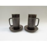 A pair of Einer Hellevoe BR keramik chocolate cups and saucers with vertical line detail. Cups