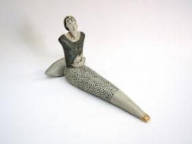 HELEN MARTINO (b.1947) A studio pottery seated figure. Monogrammed to the underside. 23cm long x