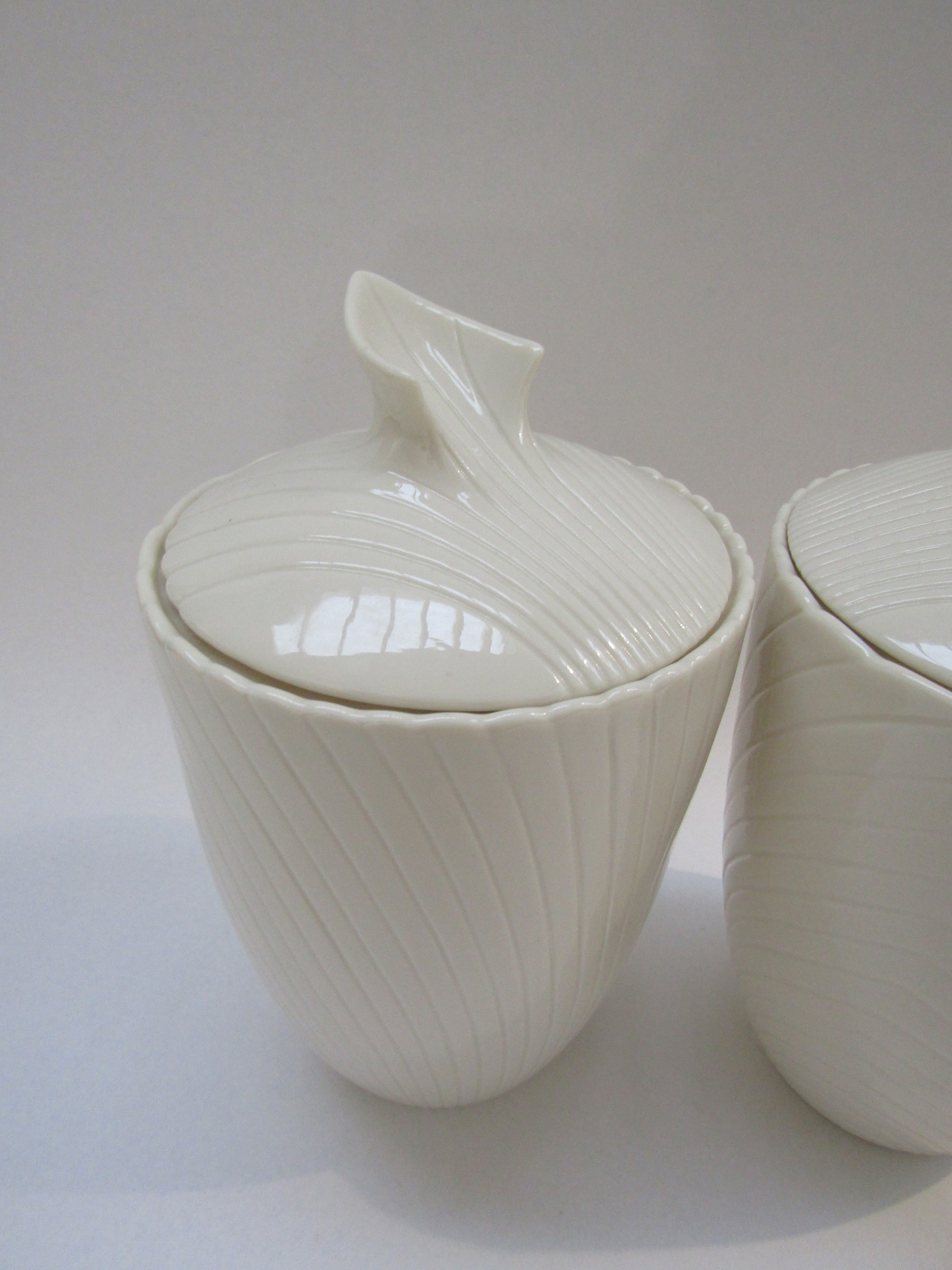A pair of Belleek porcelain lidded canisters, c1980's mark, 23cm high - Image 2 of 3
