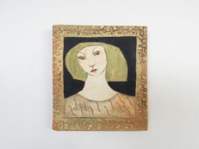 CHRISTY KEENEY (b.1958) A studio pottery wall plaque of a girls head, signed verso. 15.5cm x 14cm