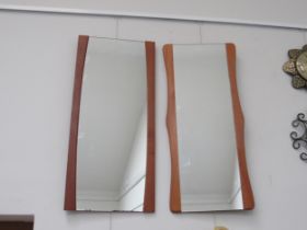 Two teak side framed wall mirrors, approx 79cm x 36cm and a 1970's brown plastic circular wall