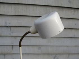 A Danish standard lamp in white finish with single adjustable spot light
