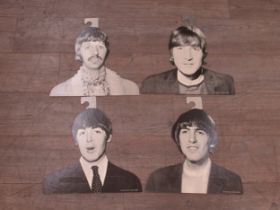 The Beatles, set of four original 1960’s cardboard coat hangers featuring John Lennon , Paul