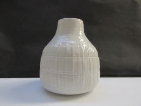 A Rosenthal ‘Studio-Linie’ gloss white porcelain vase with relief form. Designed by Elsa Fischer-