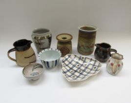 A collection of assorted studio pottery including vases, jugs and bowls, various makers. Tallest