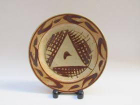 A Wenford Bridge Pottery plate, brushwork detail in tenmoku glaze. Possibly by Michael Cardew,