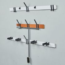 A 1960s (probably German) wall mounting coat rack system with teak and formica rails with various