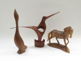 Two stylised abstract vintage mid-century wooden bird sculptures and a carved wooden horse