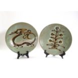 Two Mashiko Pottery plates by the same hand with pale olive glaze ground, one with painted dragon