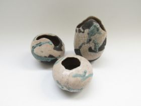 Three Tessa Oates Raku studio pottery vases with impressed potters marks. Tallest 14cm