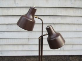 A Danish standard lamp in brown painted metal finish with twin adjustable spot lights