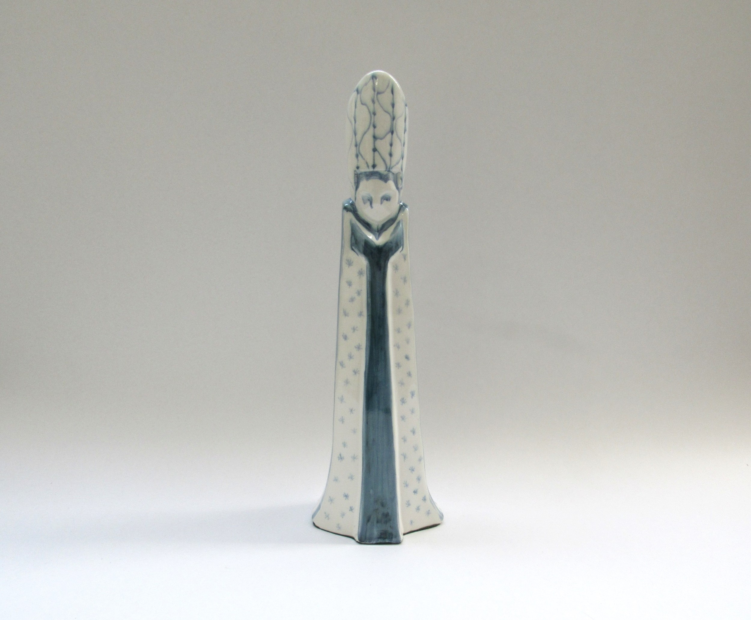 A David Sharp Rye Pottery figural candle holder modelled as a Bishop. Blue and white glaze, 39.5cm