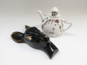 A black and gold retro wall plaque/sconce in the form of a deers head and a Wade pottery novelty tea