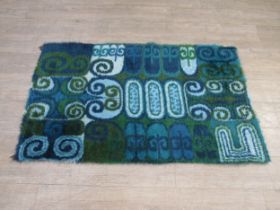 A Scandinavian Rya rug with blue abstract design. 158cm x 94cm