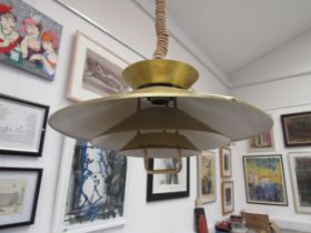 A Danish four tiered ceiling light in the Poulsen style in brassed metal and white finish with
