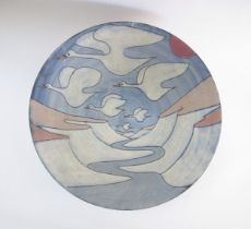 TESSA FUCHS (1936-2012) A large earthenware bowl decorated with flying Swans. Potters seal to