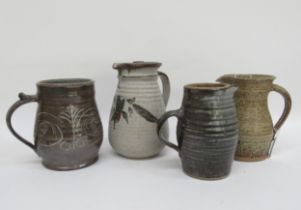 A Robert Tinnyunt studio pottery lidded coffee jug, 20cm high, together with three other studio