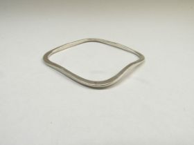 A Scandinavian sterling modernist style bangle with impressed 925 and manufacturers hallmarks