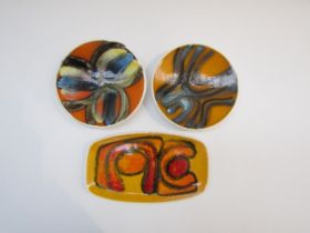 Three Poole Delphis pin dishes, two 12.5cm diameter, late 1960's black backstamp and a 1970's 361