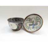 Two small studio pottery bowls with painted abstract decoration, indistinct marks to bases.