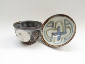 Two small studio pottery bowls with painted abstract decoration, indistinct marks to bases.