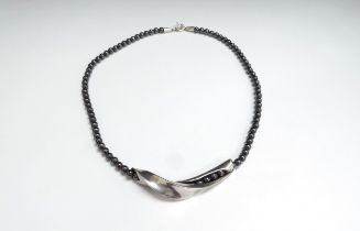 A Georg Jensen silver and hematite bead necklace by Hans Hanson, boxed